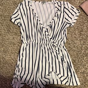 A size L for juniors. Black and white striped romper. Brand is J for Justify